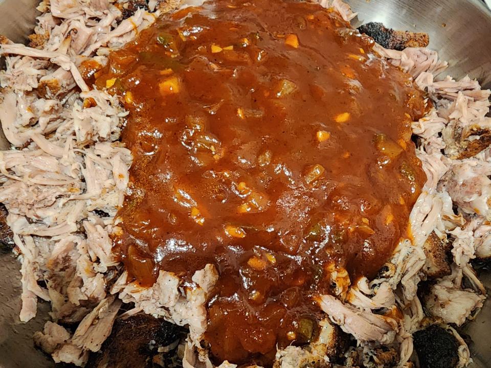 Pulled pork with homemade barbecue sauce on top.