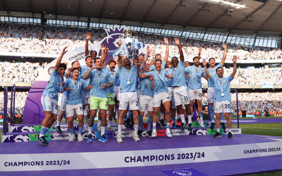 Kyle Walker and his players with the trophy