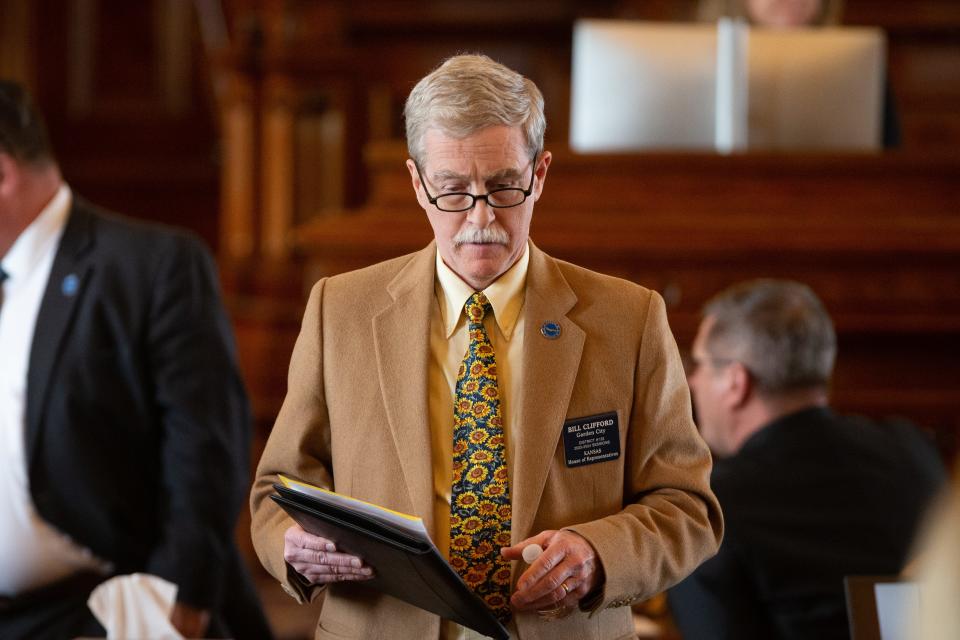 Rep. Bill Clifford, R-Garden City, walks back to his seat after speaking on on a bill during Wednesday's session.