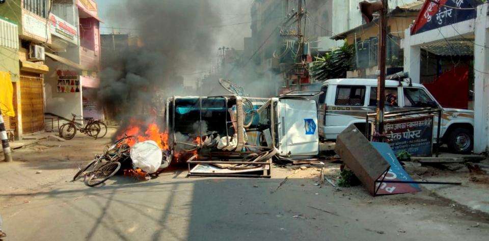 A vehicle in flames after it was set on fire by an angry mob during a protest over recent police firing during a Durga Puja event, in Munger, Thursday, 29 October