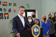 California Gov. Gavin Newsom announces new state efforts to better protect the health of communities near oil fields at a news conference at the Wilmington Boys & Girls Club in Wilmington, Calif., Thursday, Oct. 21, 2021. California's oil and gas regulator on Thursday proposed that the state ban new oil drilling within 3,200 feet of schools, homes and hospitals to protect public health in what would be the nation's largest buffer zone between oil wells and communities. (AP Photo/Eugene Garcia)