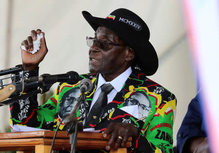 President Robert Mugabe speaks to supporters gathered to celebrate his 93rd birthday at Matopas near Bulawayo, Zimbabwe, February 25, 2017. REUTERS/Philimon Bulawayo