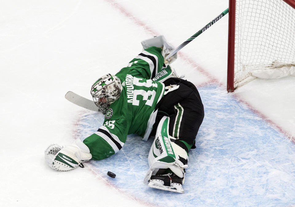 Dallas Stars goalie Anton Khudobin (35) makes a save against the Colorado Avalanche during first-period NHL Western Conference Stanley Cup playoff action in Edmonton, Alberta, Sunday, Aug. 30, 2020. (Jason Franson/The Canadian Press via AP)