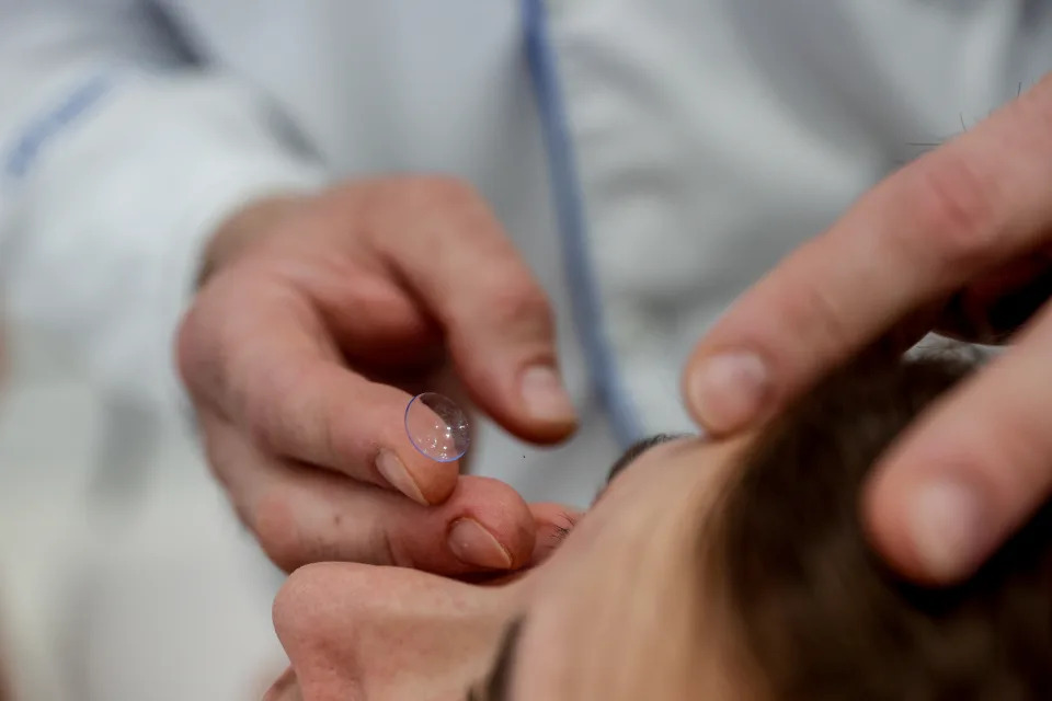 MADRID, SPAIN - MAY 30: A worker at Primera Opticos Fersan opticians holds a contact lens on May 30, 2024, in Alcala de Henares, Madrid, Spain. Both lenses and contact lenses will become part of the benefits covered by Social Security in 2025, the Minister of Health announced this month. (Photo By Ricardo Rubio/Europa Press via Getty Images)