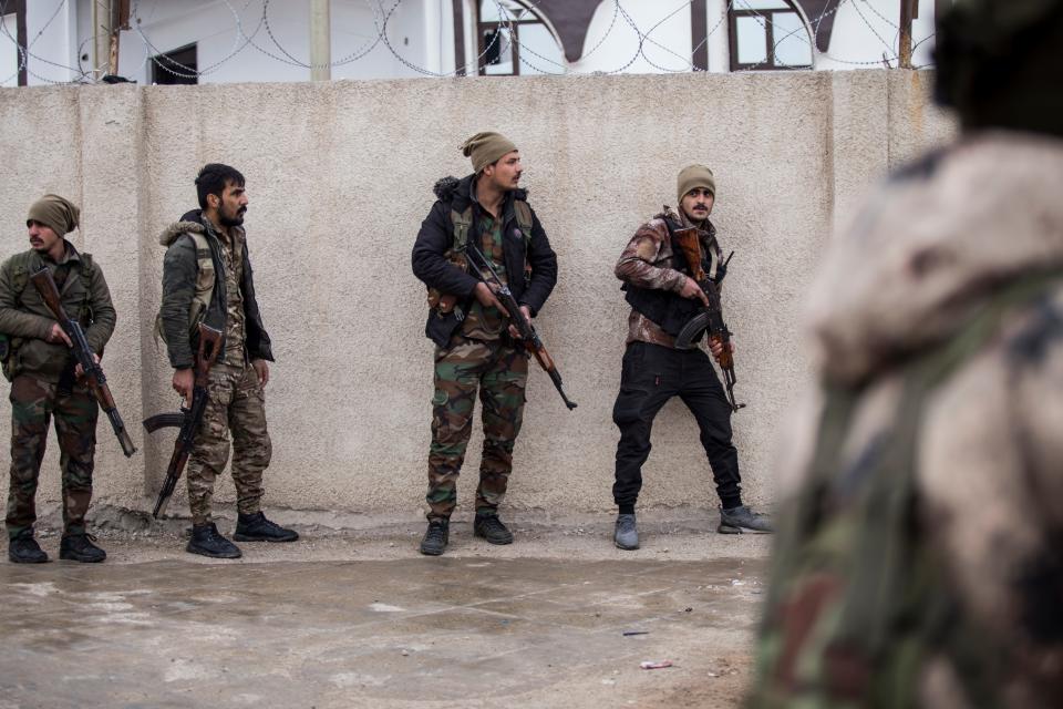 Syrian Democratic Forces soldiers hold a position in Hassakeh, northeast Syria, Thursday, Jan. 27, 2022.