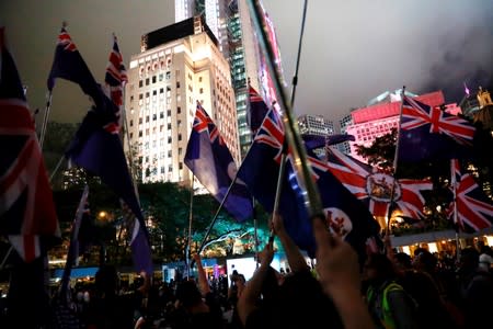 Anti-extradition bill protesters attend a rally calling on the British and U.S. governments to monitor the implementation of "one country two systems" principal, in Hong Kong