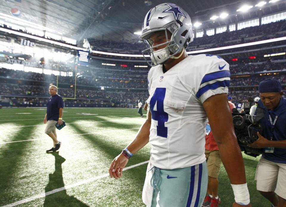 Sep 11, 2016; Arlington, TX, USA; Dallas Cowboys quarterback Dak Prescott (4) leaves the field after losing to the New York Giants 20-19 at AT&T Stadium. Giants 20, Cowboys 19. Mandatory Credit: Erich Schlegel-USA TODAY Sports