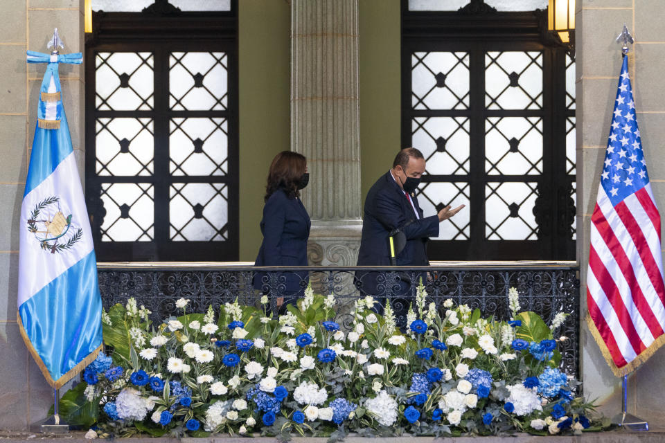 Guatemalan President Alejandro Giammattei, gestures to Vice President Kamala Harris as they finish an official photograph, Monday, June 7, 2021, at the National Palace in Guatemala City. (AP Photo/Jacquelyn Martin)