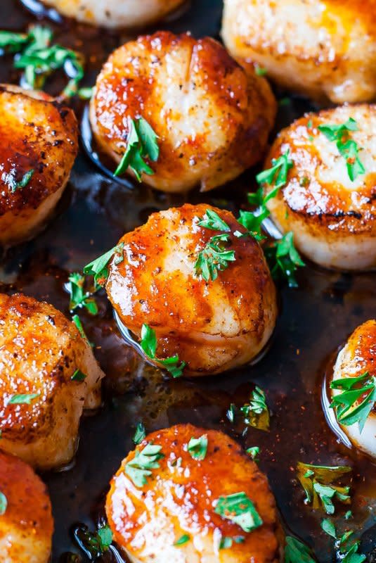 <p>Peas and Crayons</p><p>Quick and easy sriracha glazed seared scallops are finished off with a spicy and super flavorful homemade sriracha pan sauce! Delicious!</p><p><strong>Get the recipe: <a href="https://peasandcrayons.com/2016/04/sriracha-glazed-seared-scallops-recipe.html" rel="nofollow noopener" target="_blank" data-ylk="slk:Sriracha Glazed Seared Scallops;elm:context_link;itc:0;sec:content-canvas" class="link ">Sriracha Glazed Seared Scallops</a></strong></p>