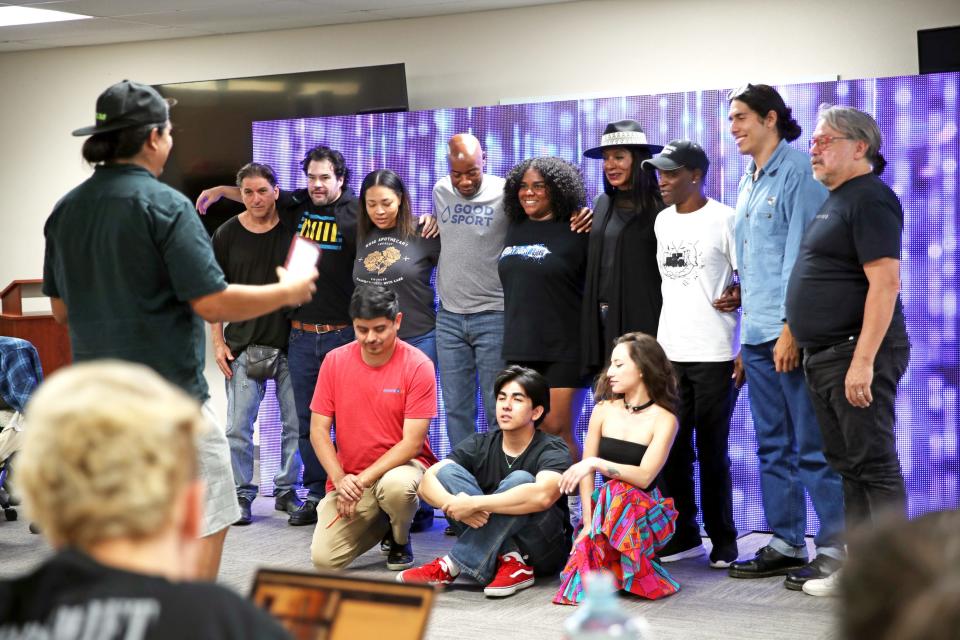 Actors gather for a group photo following a June 19 rehearsal in Palm Desert for a new Green Room Theatre Company Coachella Valley play called "Displacement: Stories from Section 14."