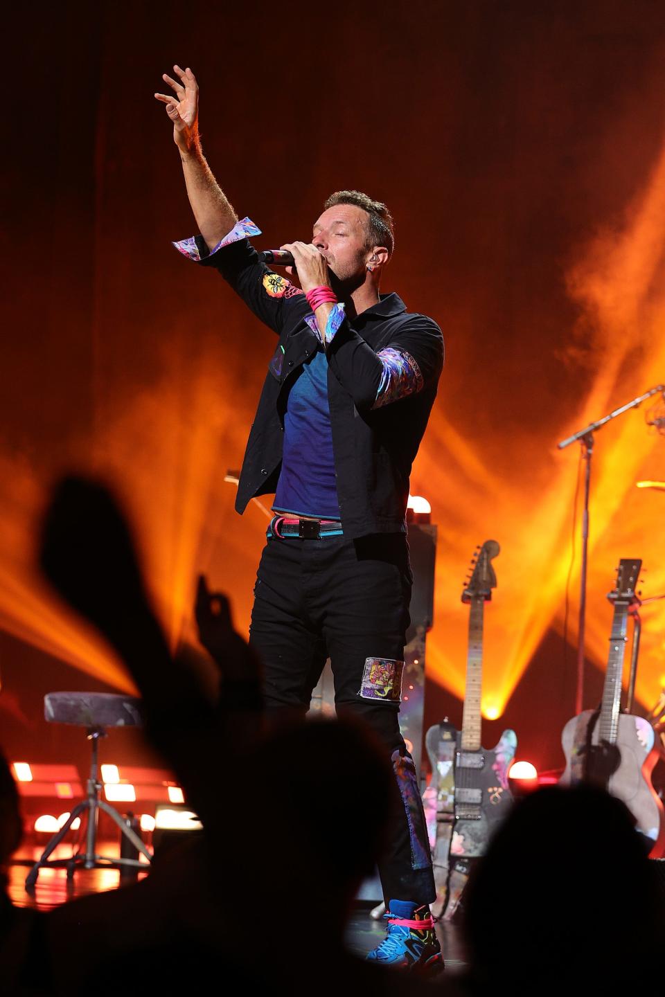 Chris Martin of Coldplay sings at the Apollo Theater in New York on Thursday.