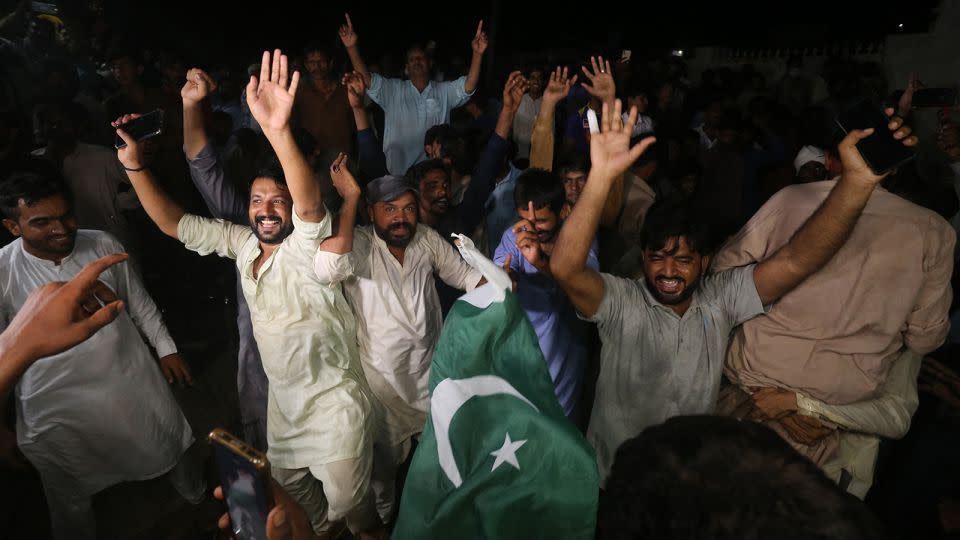 Supporters and family members of Pakistani athlete Arshad Nadeem celebrate after his Olympic victory at Mian Channu in Khanewal district, Pakistan on August 9, 2024. - Shahid Saeed Mirza/AFP/Getty Images