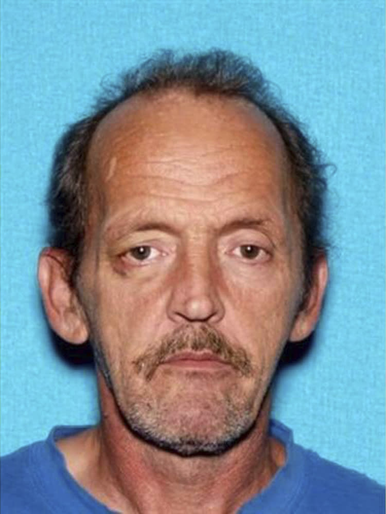 This photo provided by Montgomery County Sheriff's Office shows Kirby Gene Wallace. Authorities say they’re closing in on Wallace, a multiple-murder suspect in Tennessee, using helicopters and dogs in rugged terrain. Wallace has been spotted for a third time in Stewart County, where Sheriff Frankie Gray says his deputies are using K-9 units to encircle the suspect in a heavily wooded area. (Montgomery County Sheriff's Office via AP)