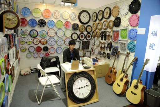 An exhibitor waits for customers at a product fair in Shanghai on March 1, 2012. A fall in China's manufacturing activity will add to pressure on policymakers to further loosen monetary policy and comes days after Australian resources giant BHP Billiton said China's demand for iron ore, a key manufacturing component, was flattening