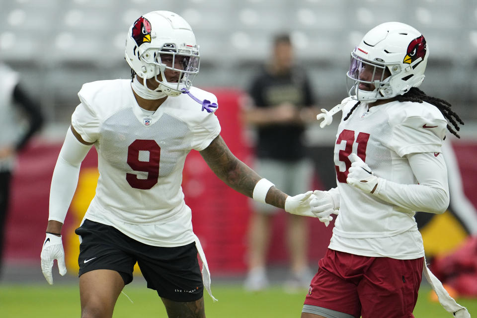 Arizona Cardinals safety Isaiah Simmons (9) covers safety Andre Chachere (31) during NFL football training camp practice at State Farm Stadium, Monday, Aug. 7, 2023, in Glendale, Ariz. (AP Photo/Ross D. Franklin)