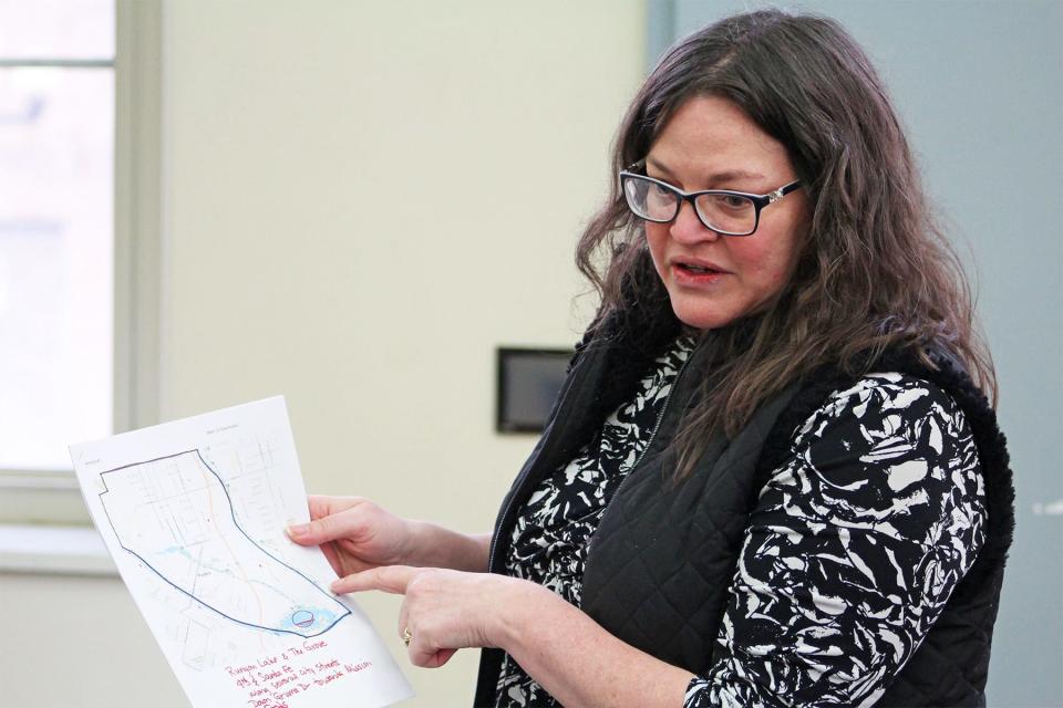 Teah Miller, the community facilitator for Pueblo's point-in-time count, explains to volunteers an area they plan to cover for the count during a meeting on Jan. 25, 2023.