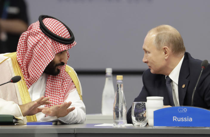 Saudi Arabia’s Crown Prince Mohammed bin Salman, left, and Russia’s President Vladimir Putin speak at the start of the G-20 summit in Buenos Aires, Argentina, Friday, Nov. 30, 2018. (Photo: Natacha Pisarenko/AP)