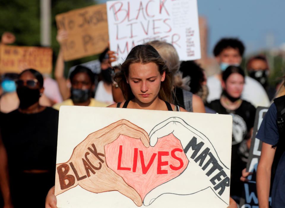 People march during a protest following the police shooting of Jacob Blake, a Black man, in Kenosha, Wis. (Brendan McDermid/Reuters)