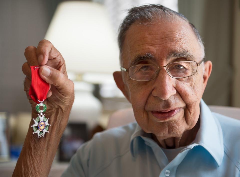 WWII veteran Cosmo Uttero of Bradenton, was appointed in 2015 to the rank of Knight of the Legion of Honor by the Consulate General of France. He received the Legion d'Honneur medal during an induction ceremony in Tampa.