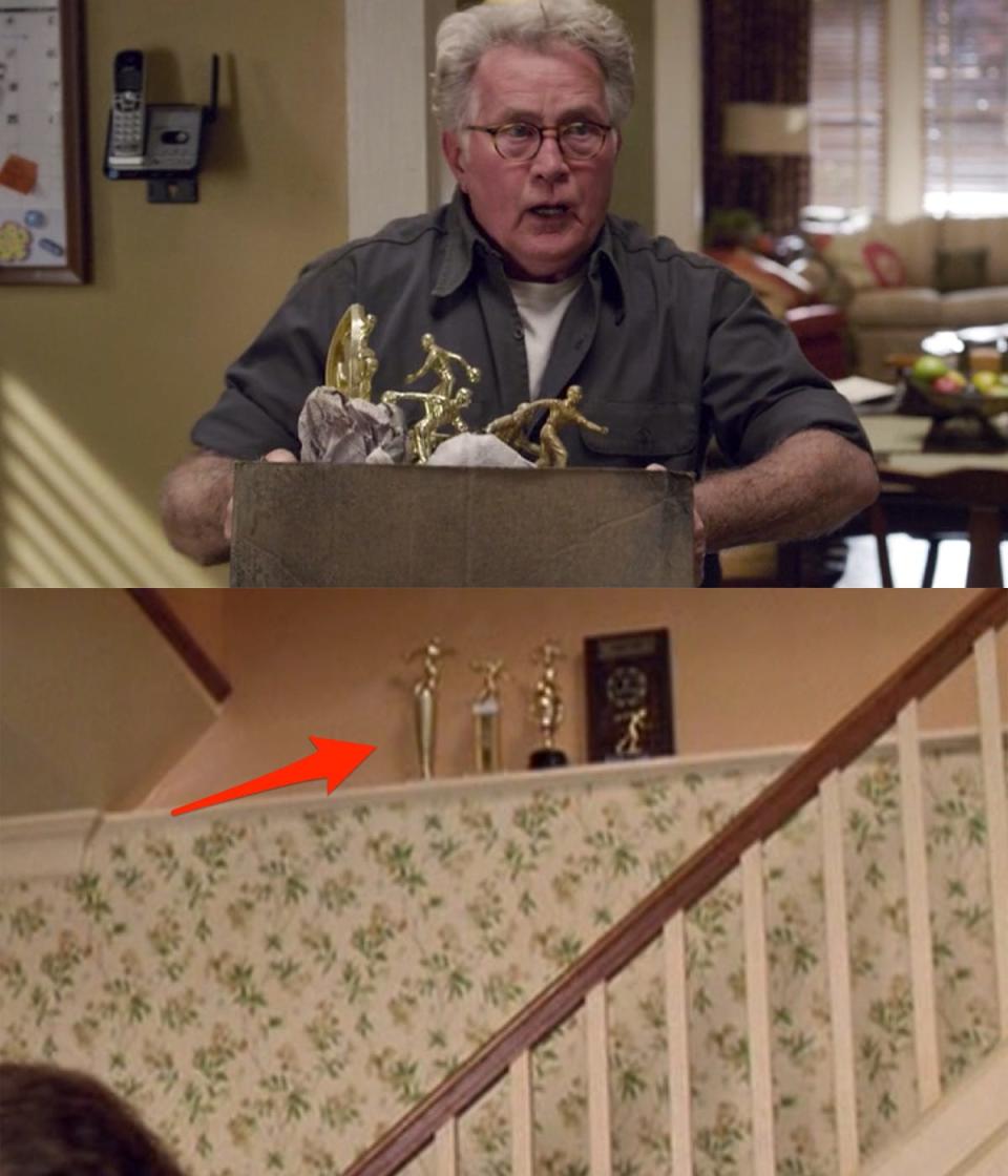 Uncle Ben holding a box of trophies in "The Amazing Spider-Man."