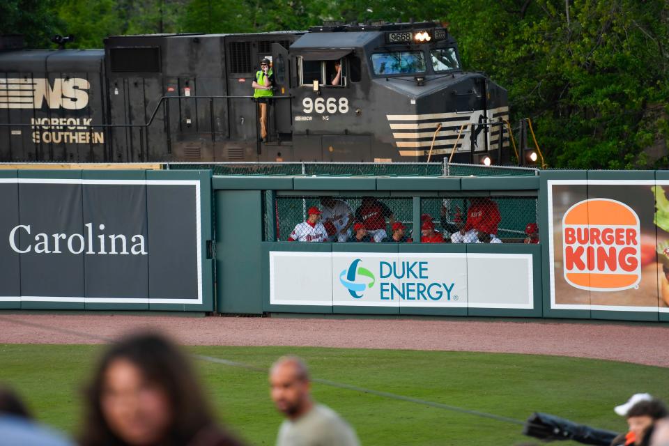 A train stops behind Fluor Field to watch baseball during the Greenville Drive game on Wednesday, April 12, 2023.