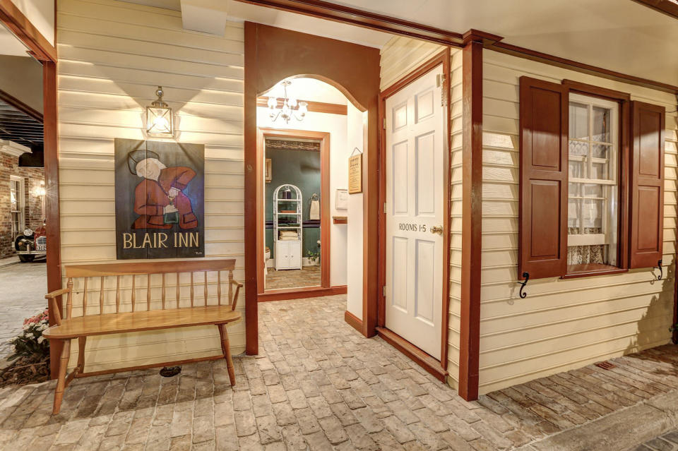 The basement also includes a fully-functioning bathroom disguised as a quaint inn.  (Home Visit)