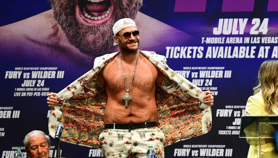 Boxer Tyson Fury arrives for press conference with Deontay Wilder (off frame) on June 15, 2021 in Los Angeles, California to announce their third WBC heavyweight championship ficght scheduled for July 24 in Las Vegas. (Photo by Frederic J. BROWN / AFP) (Photo by FREDERIC J. BROWN/AFP via Getty Images)