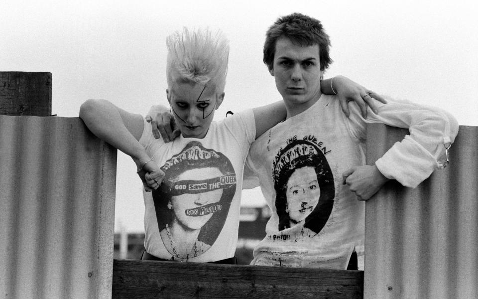 Pamela Rooke, aka Jordan, and Simon Barker, aka Six, modelling Sex Pistols God Save The Queen T-shirts in 1977 - Mirrorpix