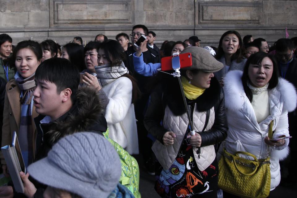 Tourist leave the Louvre museum in Paris,Friday, Feb. 3, 2017. A French soldier shot and seriously wounded a man in a shopping mall beneath the Louvre Museum on Friday after he tried to attack them and shouted "Allahu akbar," officials said. (AP Photo/Thibault Camus)