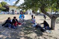 People rest in a garden following an earthquake in Amatrice, central Italy, August 24, 2016. REUTERS/Ciro De Luca