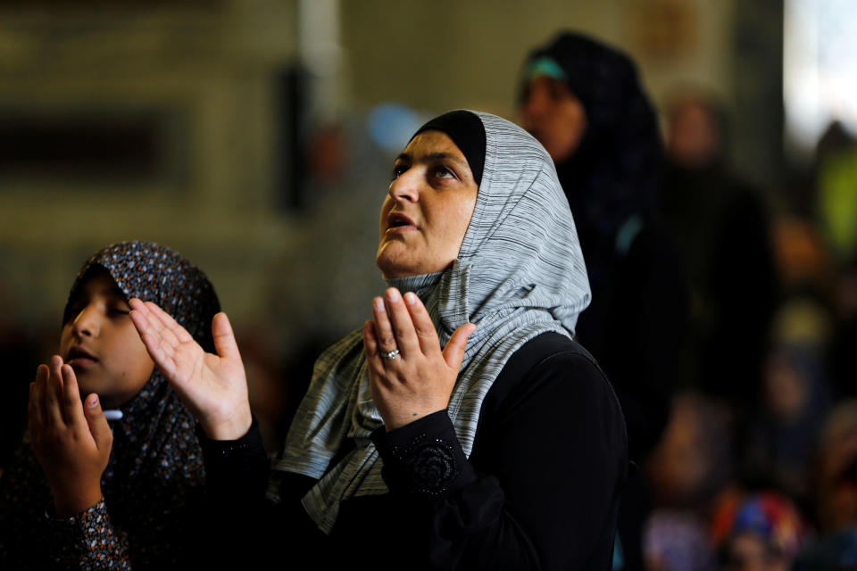 A Muslim woman prays during the Friday prayers for Ramadan, on the compound known to Muslims as Noble Sanctuary and to Jews as Temple Mount in Jerusalem's Old City June 16, 2017 . REUTERS/Ammar Awad