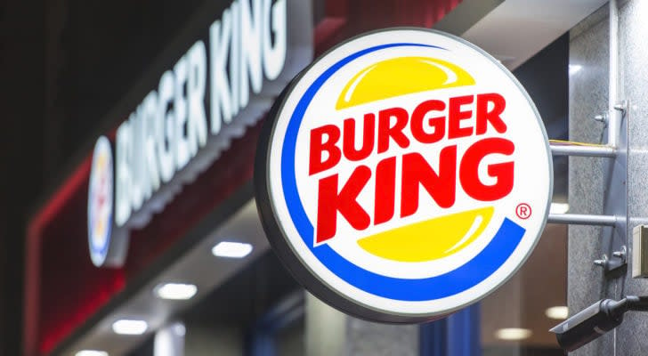 A photo of a Burger King light-up sign outside a Burger King restaurant.