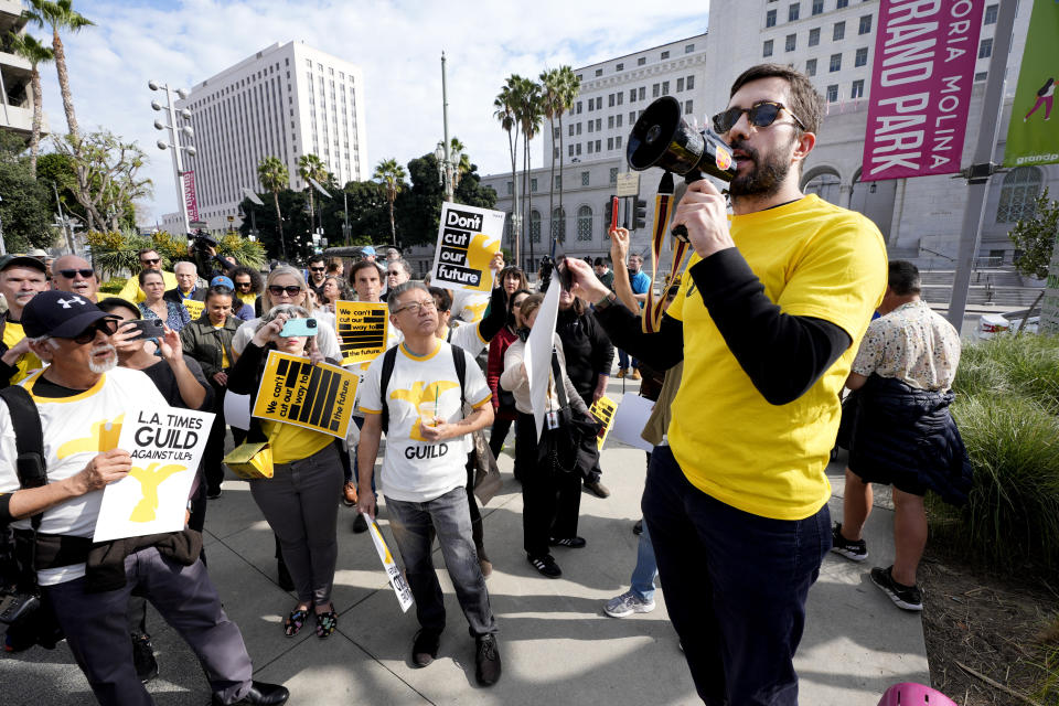 Matt Hamilton, an investigative reporter for the Los Angeles Times, talks to staff and supporters during a rally in downtown Los Angeles on Friday, Jan. 19, 2024. Guild members of the Los Angeles Times participated in one-day walkout to protest imminent layoffs. The job action Friday is the first newsroom union work stoppage in the history of the newspaper, which began printing in 1881. (AP Photo/Richard Vogel)