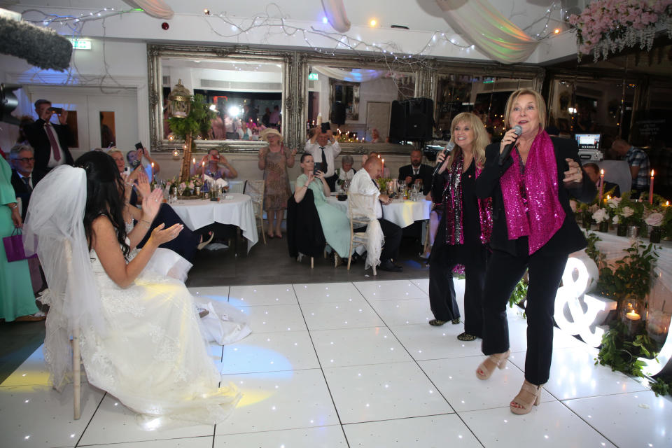 Norwegian Eurovision act Bobbysocks perform at for Samantha Fox and Linda Birgitte Olsen at their wedding. (Fox Media via Getty Images )