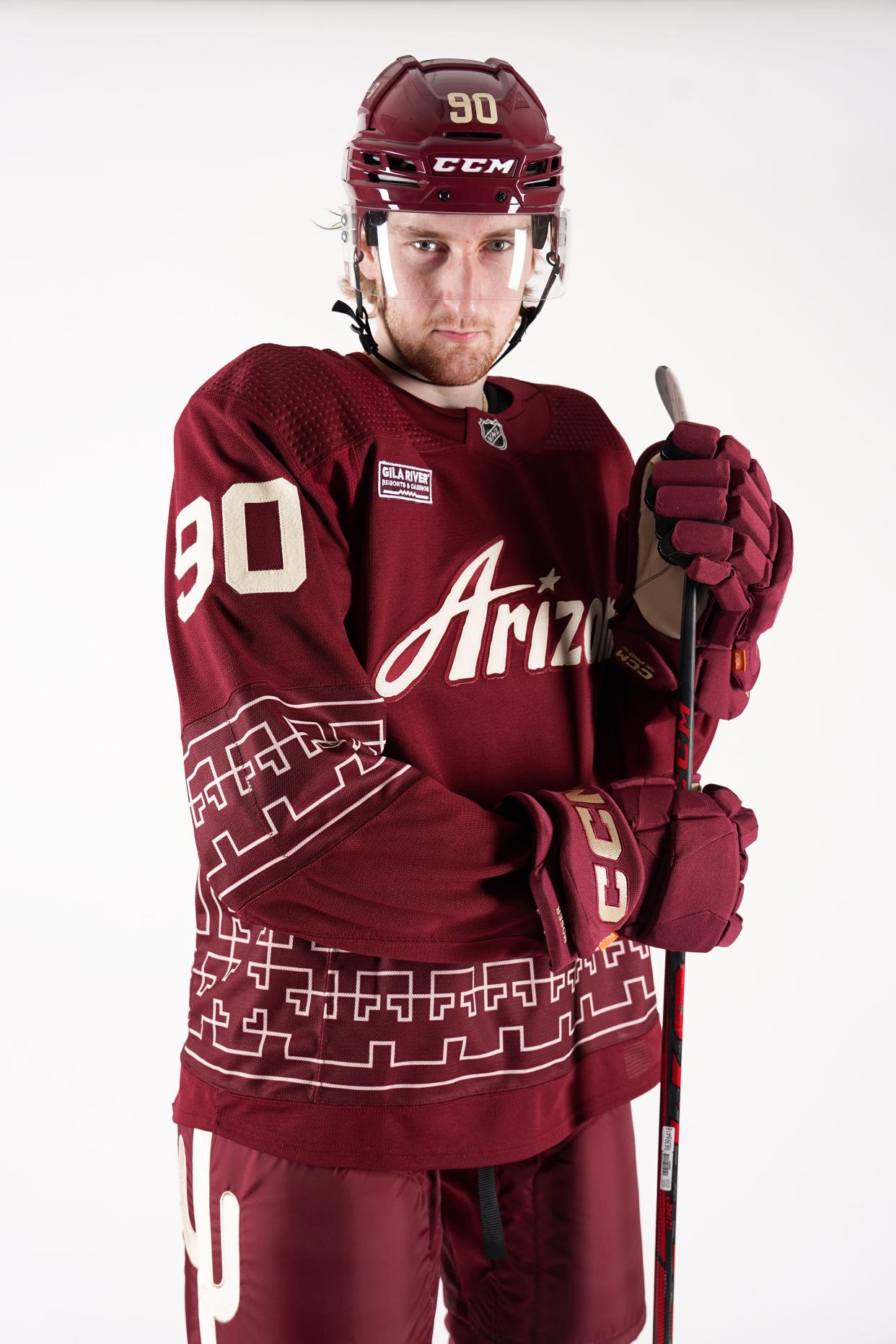 Arizona Coyotes defenseman J.J. Moser wears the new third jersey.