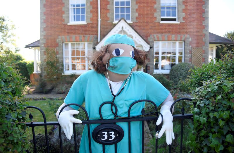 Scarecrows representing key workers lighten the daily lockdown walk, as the number of the coronavirus disease cases (COVID-19) grows around the world, in the village of Capel