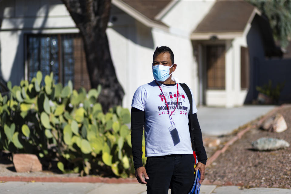 Meniano poses for a portrait while canvassing. (Photo: Miranda Alam for HuffPost)