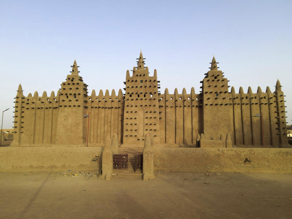 FILE- The world's largest mud-brick building, the Great Mosque of Djenne, Mali, awaits its annual replastering, Friday, May 10, 2024. The Mosque — the world's largest mud-brick building — used to draw tens of thousands of tourists every year to central Mali. Now it's threatened by conflict between Islamic rebels, government forces and other groups. (AP Photo/Moustapha Diallo, File)