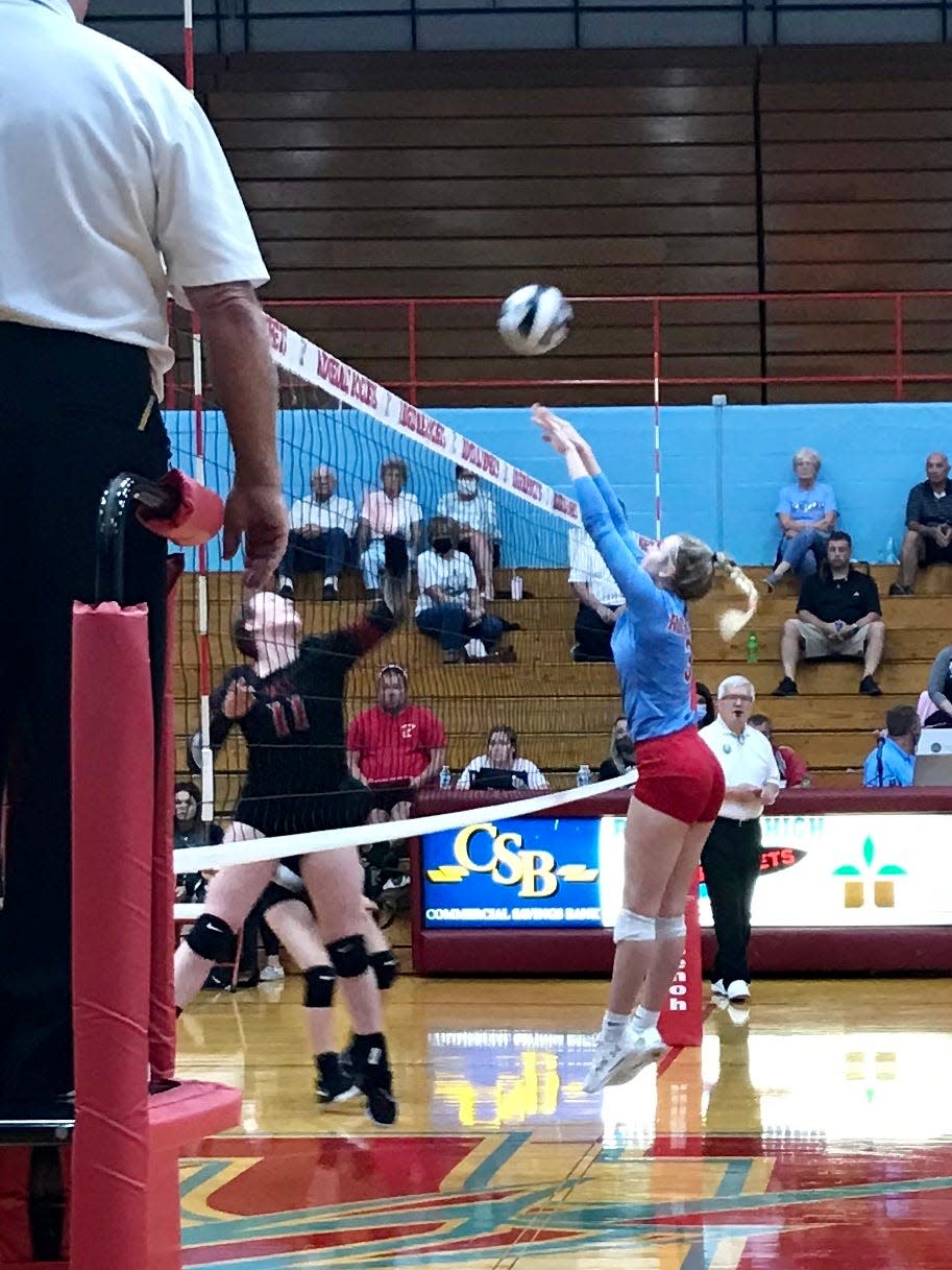 Ridgedale's Grace Staton goes up for a block during a volleyball match against Upper Scioto Valley last year.