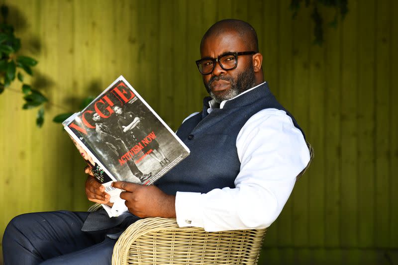 Photographer and founder of What We Seee Harriman, sits in his garden in Woking