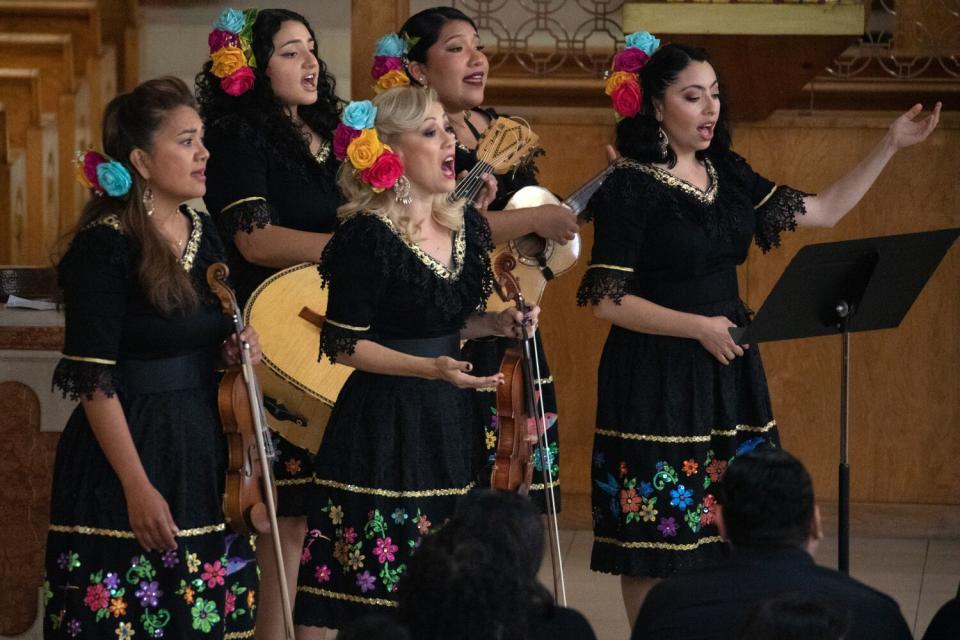 Mariachi Las Colibri performs at the funeral.