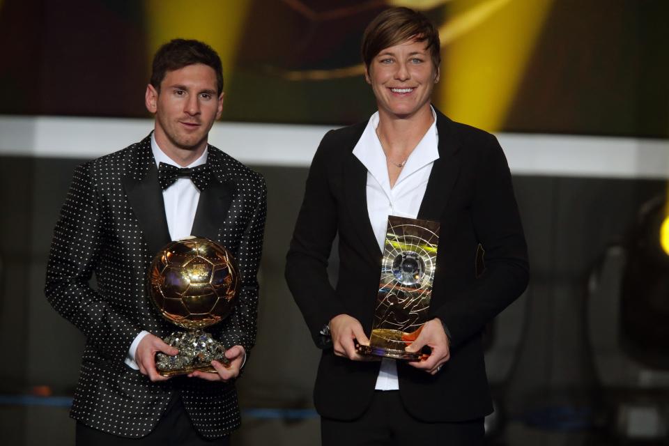 ZURICH, SWITZERLAND - JANUARY 07: Lionel Messi of Argentina receives the FIFA Ballon d'Or 2012 trophy and Abby Wambach of United States receives her FIFA womens player of the year trophy during the FIFA Ballon d'Or Gala 2013 at Congress House on January 07, 2013 in Zurich, Switzerland. (Photo by Christof Koepsel/Getty Images)