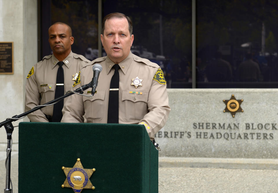 Los Angeles Sheriff's Department commander Mike Parker, right, speaks during a news conference as Capt. Roosevelt Johnson looks on, Tuesday, March 25, 2014, in Los Angeles, about the death of actor Paul Walker and his friend Roger Rodas. The Porsche carrying "Fast & Furious" star Walker was traveling up to 94 mph when it went out of control on a suburban street and crashed, killing the actor and his friend, according to an investigation by law enforcement agencies into the November accident. The sports car driven by Rodas slammed into a light pole with a 45 mph speed limit sign and burst into flames. Walker and Rodas died at the scene. (AP Photo/Mark J. Terrill)