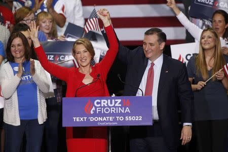 Republican U.S. presidential candidate Ted Cruz stands with Carly Fiorina after he announced Fiorina as his running mate at a campaign rally in Indianapolis, Indiana, United States April 27, 2016. REUTERS/Aaron P. Bernstein - TPX IMAGES OF THE DAY