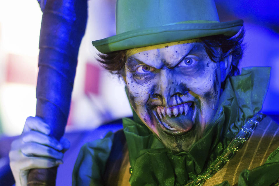 An actor dressed as a leprechaun performs at the Hopi Hari horror theme amusement park, in the Vinhedo suburb of Sao Paulo, Brazil, Friday, Sept. 4, 2020. Due to the restrictions caused by COVID-19, the park created a drive-thru tour that allow the public to enjoy the experience by car. (AP Photo/Carla Carniel)