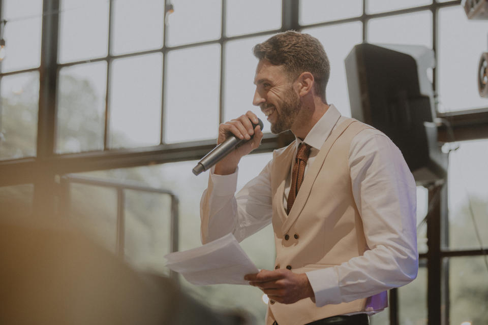 A best man giving a speech at a wedding reception