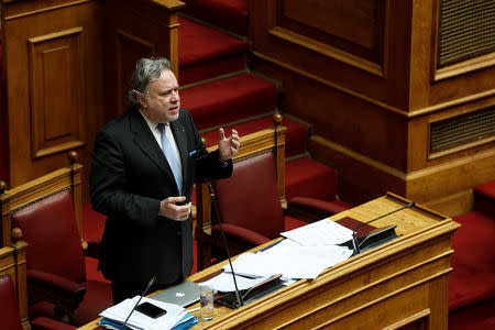 Greek Alternate Minister of Foreign Affairs George Katrougalos addresses lawmakers during a parliamentary session on a name-change agreement with neighbouring Macedonia in Athens, Greece, January 23, 2019. REUTERS/Costas Baltas
