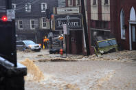 <p>Main Street is a raging river during a torrential downpour that lasted hours May 27, 2018, in Ellicott City, Md. This comes two years after another flash flood devastated the historic downtown. (Photo: Katherine Frey/The Washington Post via Getty Images) </p>