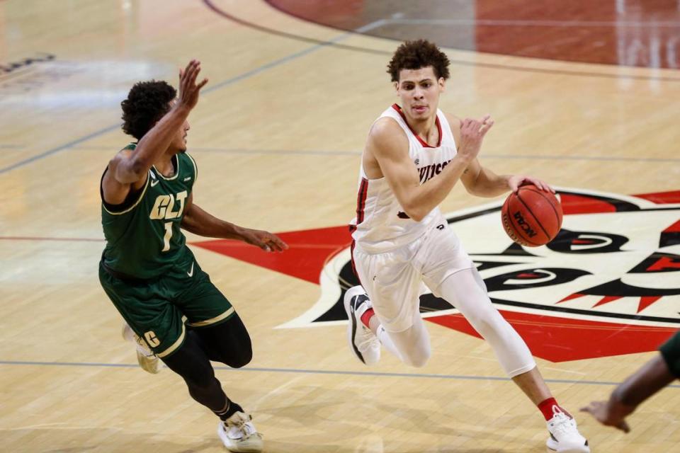 Davidson guard Kellan Grady, right, drives against Charlotte guard Jahmir Young (1) in the first half of a college basketball game in Davidson, N.C., Tuesday, Dec. 15, 2020.