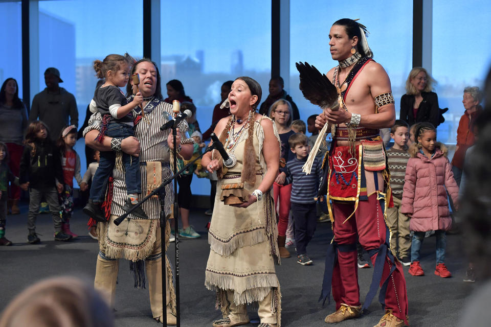 The Wampanoag Nation Singers and Dancers, including Jonathan James-Perry (L) and Kitty Hendricks Miller (C) perform at the John F. Kennedy Presidential Library and Museum on Nov. 29, 2019 in Boston to commemorate Native American Heritage Month<span class="copyright">Paul Marotta—Getty Images</span>